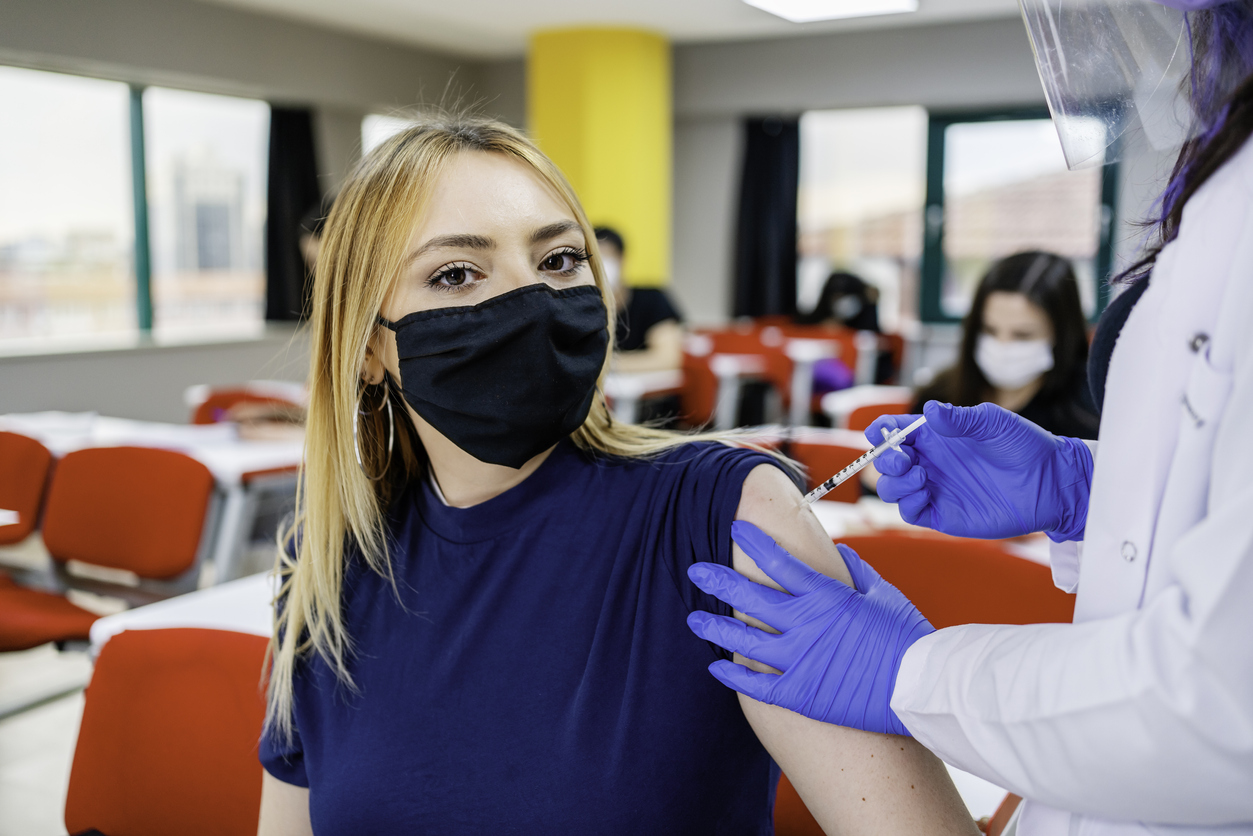 Teen getting vaccinated